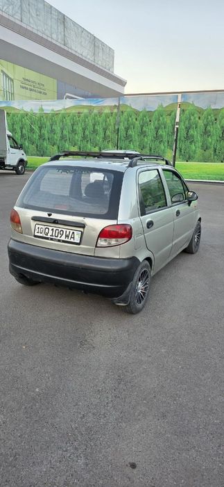 Матиз с метан газом и с кондиционером.