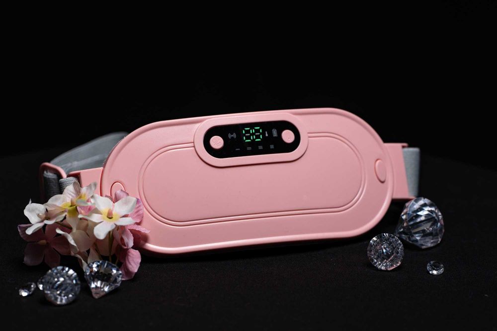 Загряващ и масажиращ колан за менструални болки