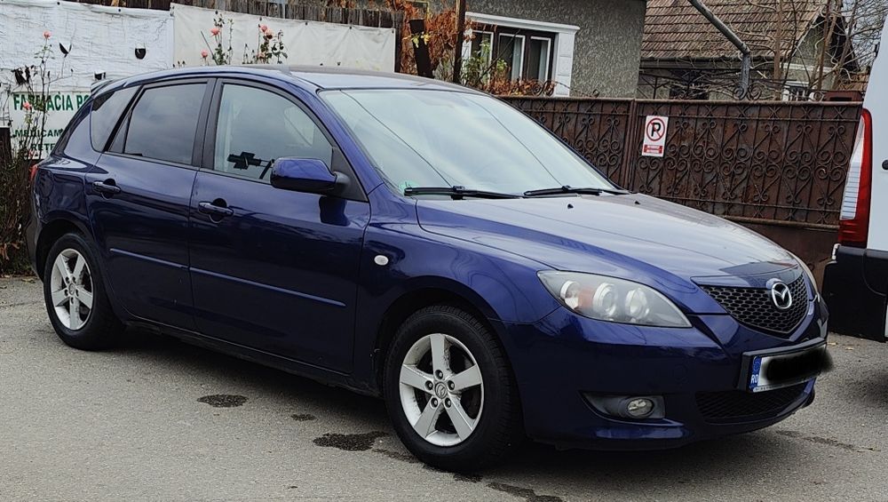 Mazda 3 1.6 benzina 2005 folie geamuri doua seturi de anvelope