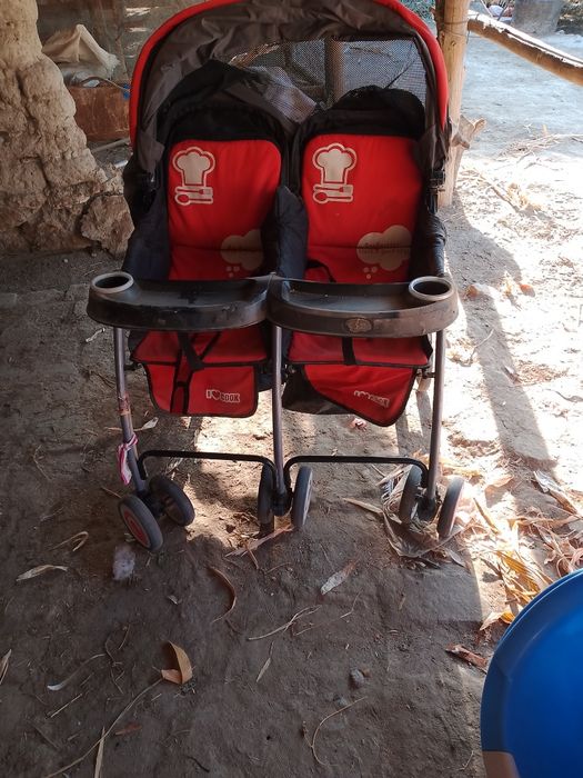 Коляска егизакларга