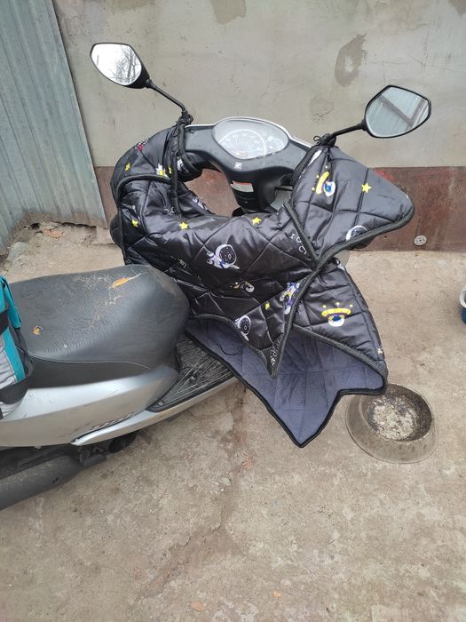 На коленник для  мопеда . Против ветра . Тізеге жапқыш