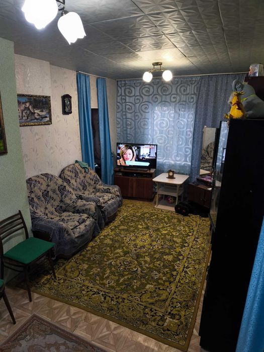 Частный дом с земельным участком, гаражом и летней кухней.