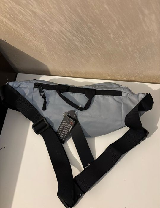 Stone island silver reflective bag