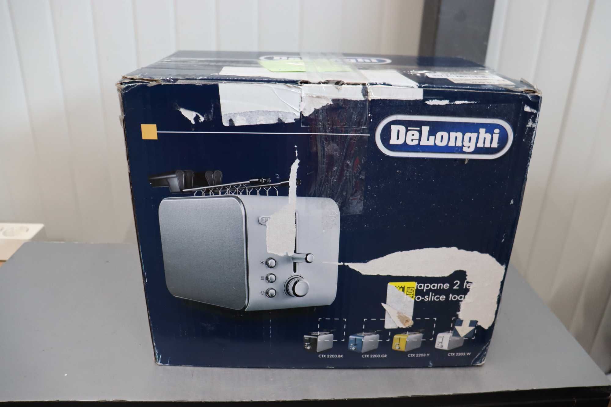 De'Longhi Тостер с щипки,3 функции, 550W , сребрист, НЕ РАБОТИ!