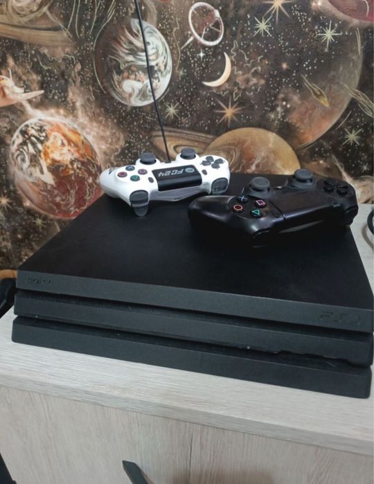 Продаю пс 4 про + 2 джостика + 12 игр