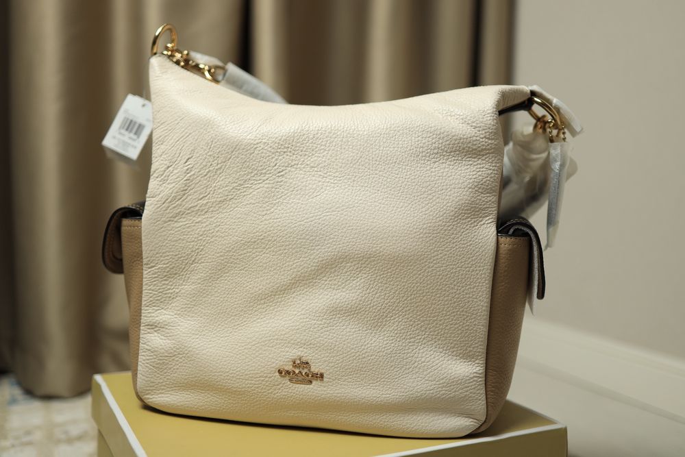 Продам новую кожанную сумку Coach