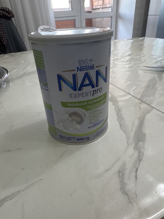 Продам смесь почти новая нан тройной комфорт и нестожен с рождения