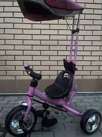 Детский розовый велосипед