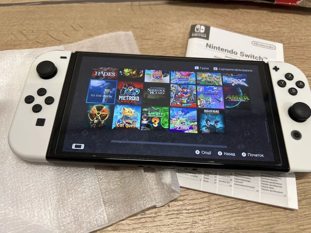 nintendo switch OLED + 35 игри на избор + 512 gb microsd