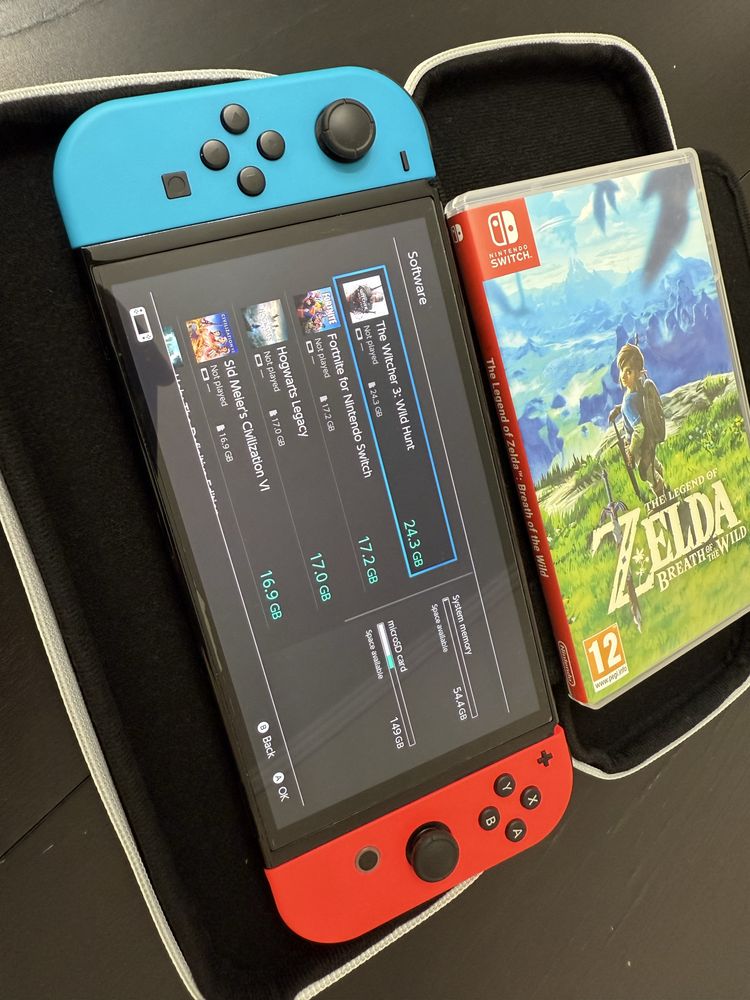 Nintendo Switch 64 GB OLEF 7” + Zelda The Breth of the Wild and Case