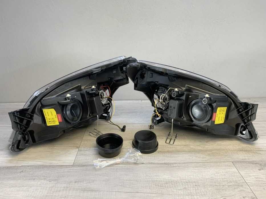 Faruri sport Opel Astra H GTC Twintop Angel Eyes look negru lupa NOU