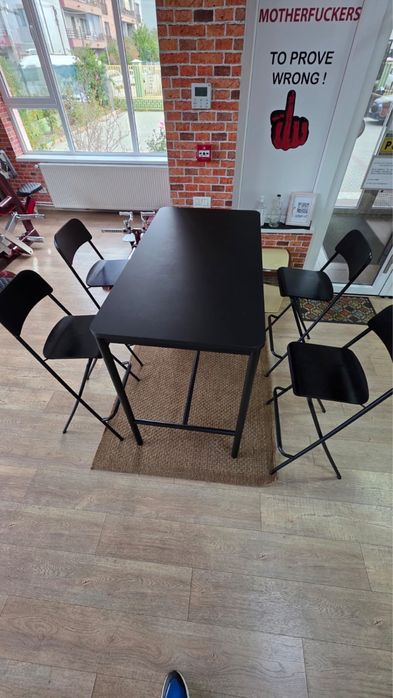 Black ikea bar table and bar stool foldable with brown rug