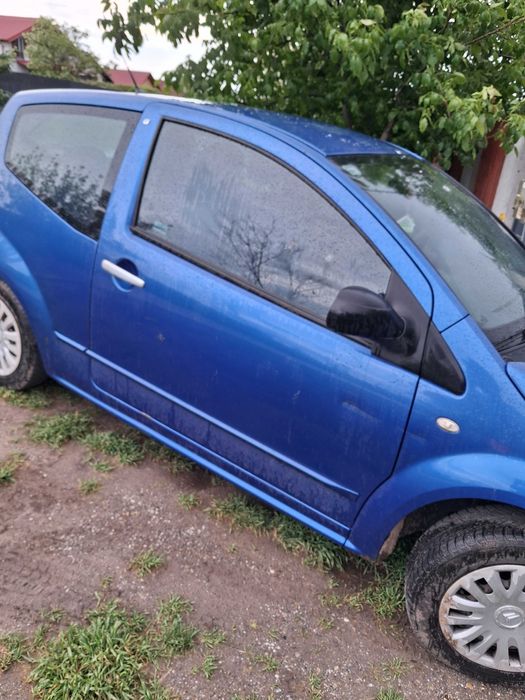 Vand / dau la schimb  pe porci masina citroen c2 benzina motor 1.4  ,