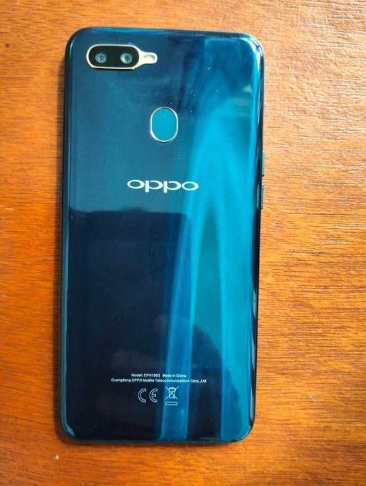 vand telefon OPPO AX7