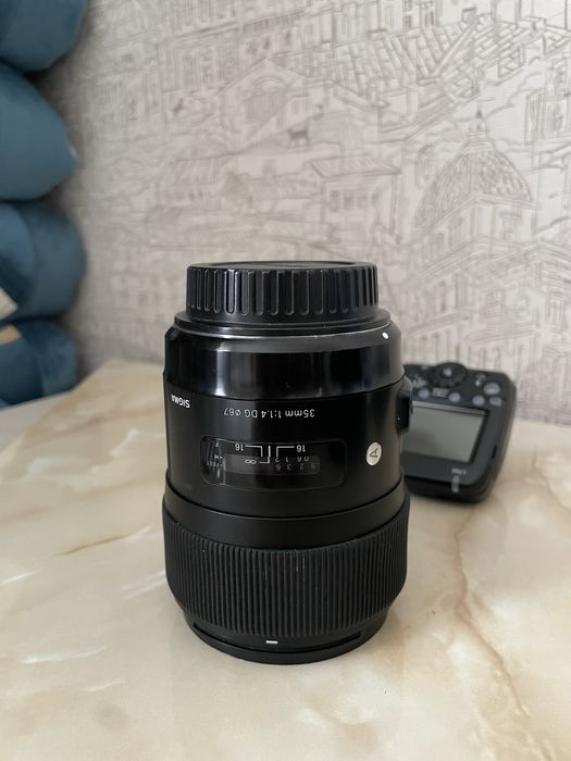 Sigma 35mm f1.4.  Сигма 35 мм 1.4 кенон