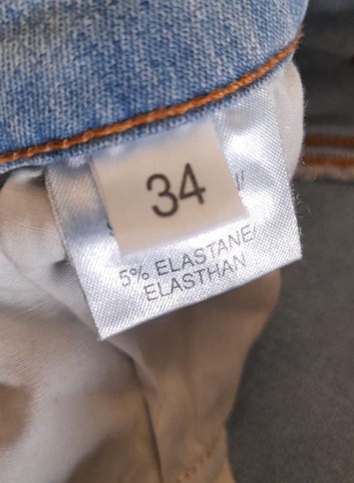 Blugi elastici cu capse