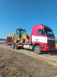 Transport buldoexcavator