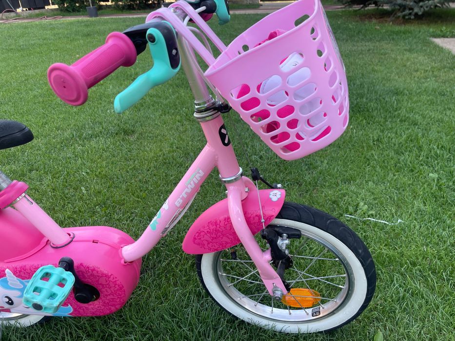 Bicicleta Btwin roz ,cu accesorii