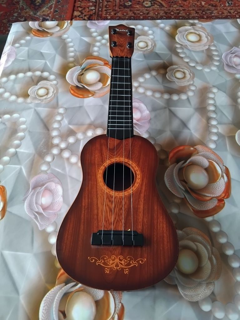 Mini Gitara chalgʻu asbob sirochna sotiladi