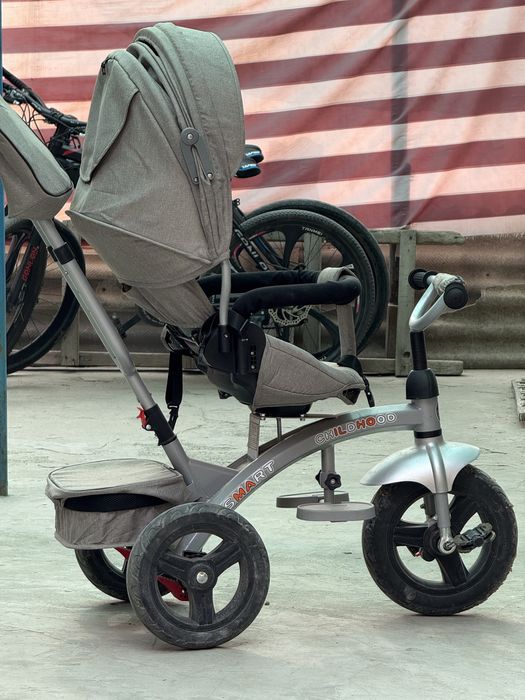 Велоколяска в управление ручкой