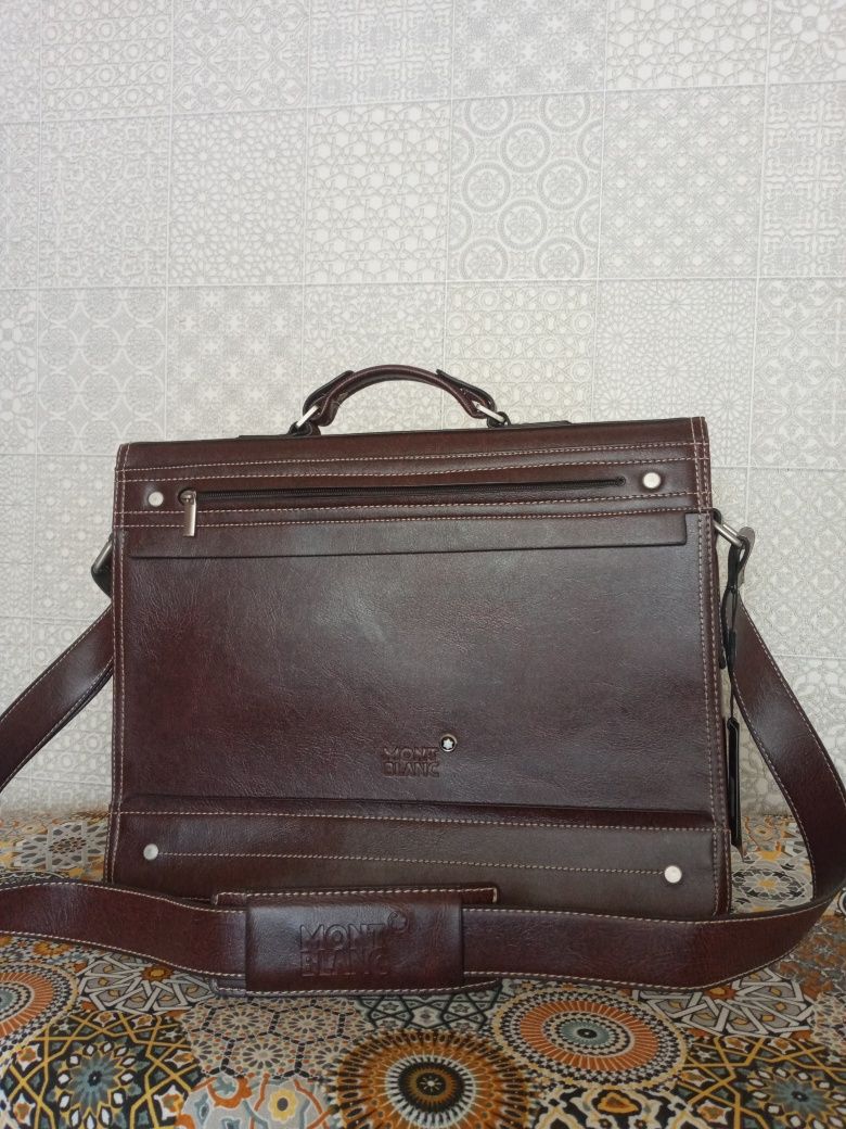 Продам мужской красивый портфель коричневого цвета,кожа,новый.