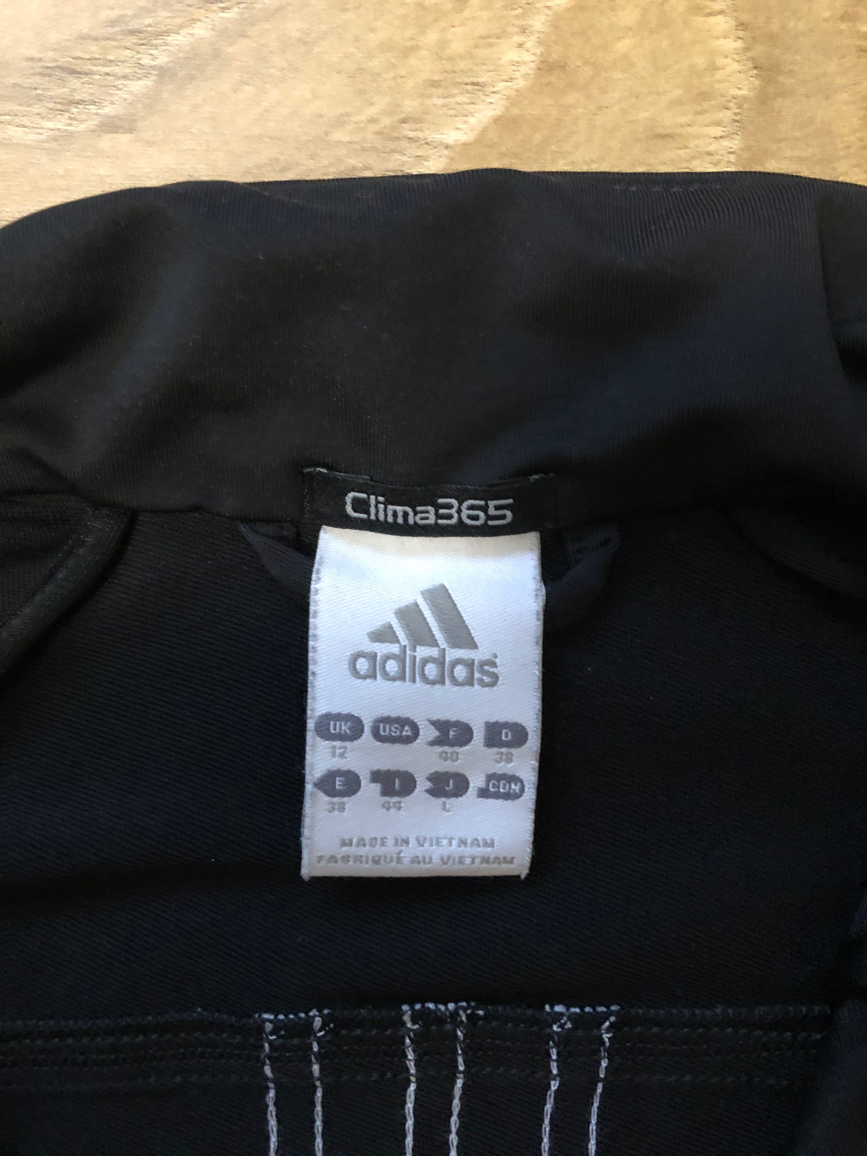 ADIDAS CLIMALITE-bluza de trening in stare impecabila pentru dame