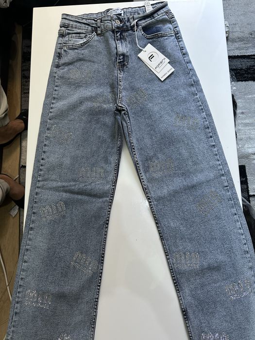 Blugi Miu Miu evazatii, disponibil toate marimile