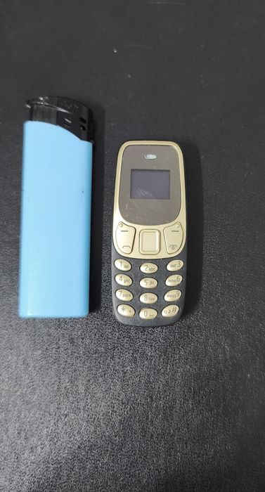 Mini telefon mobil