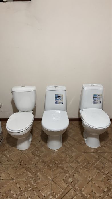 Унитазы новые.