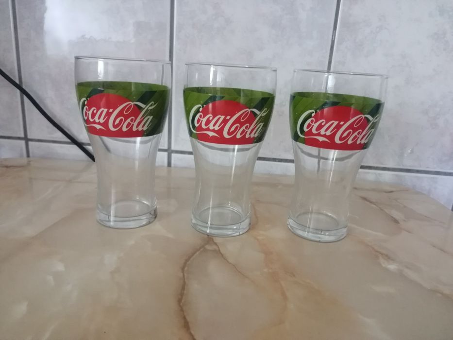 9 pahare suc Coca-Cola, ediții diferite, 300 ml
