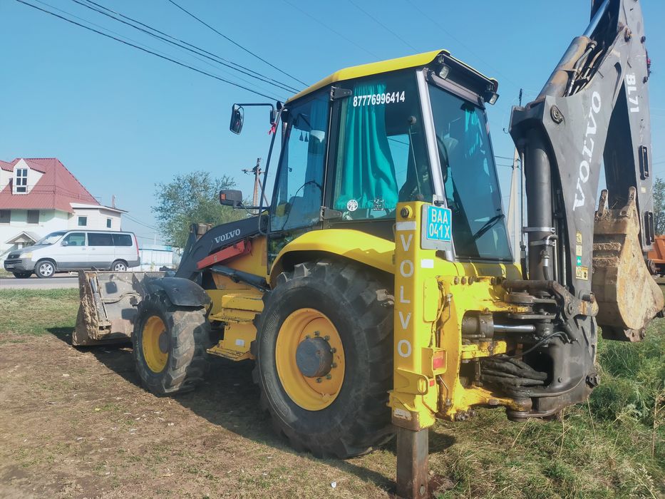 Экскаватор погрузчик Вольво бл 71