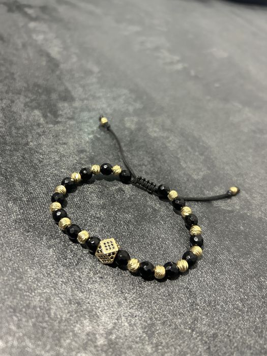 Bratara cu bilute din aur si zar cu pietricele negre din aur