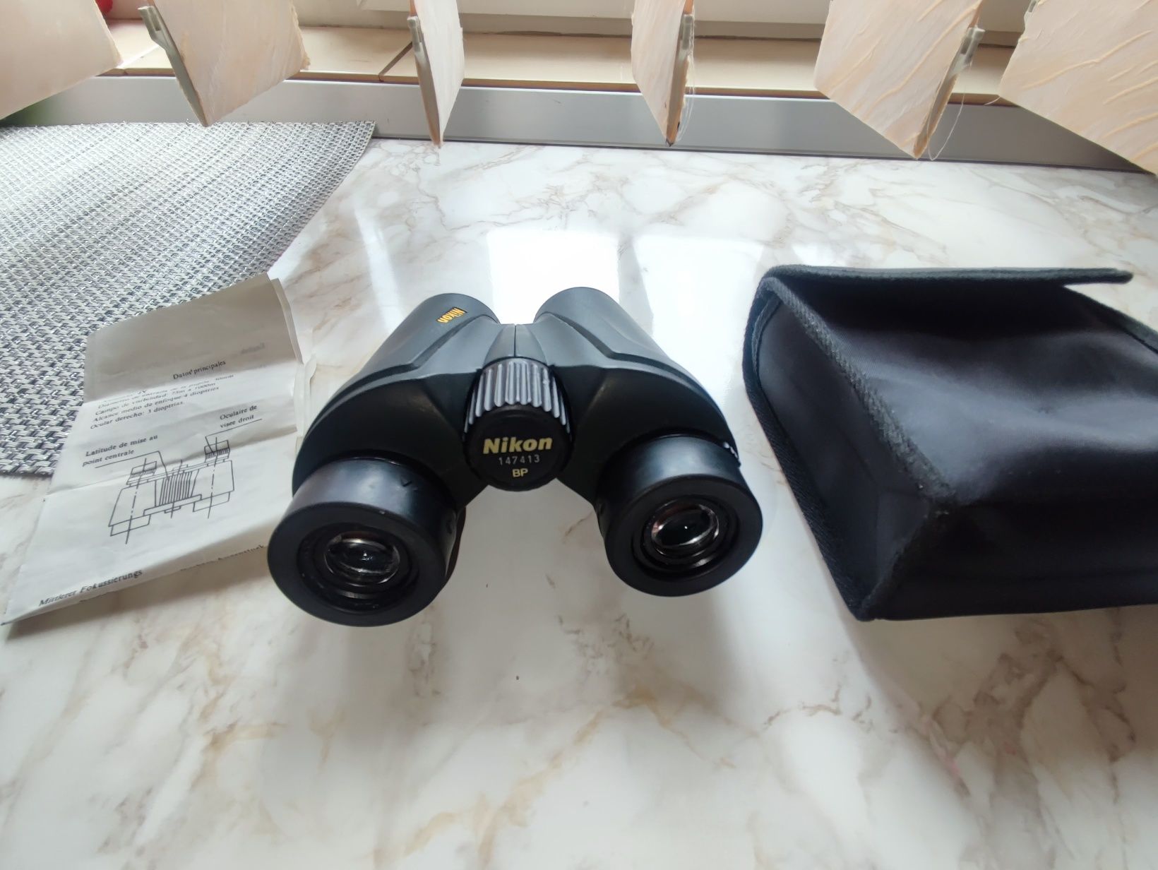 BINOCLU NIKON 
Detalii conținut