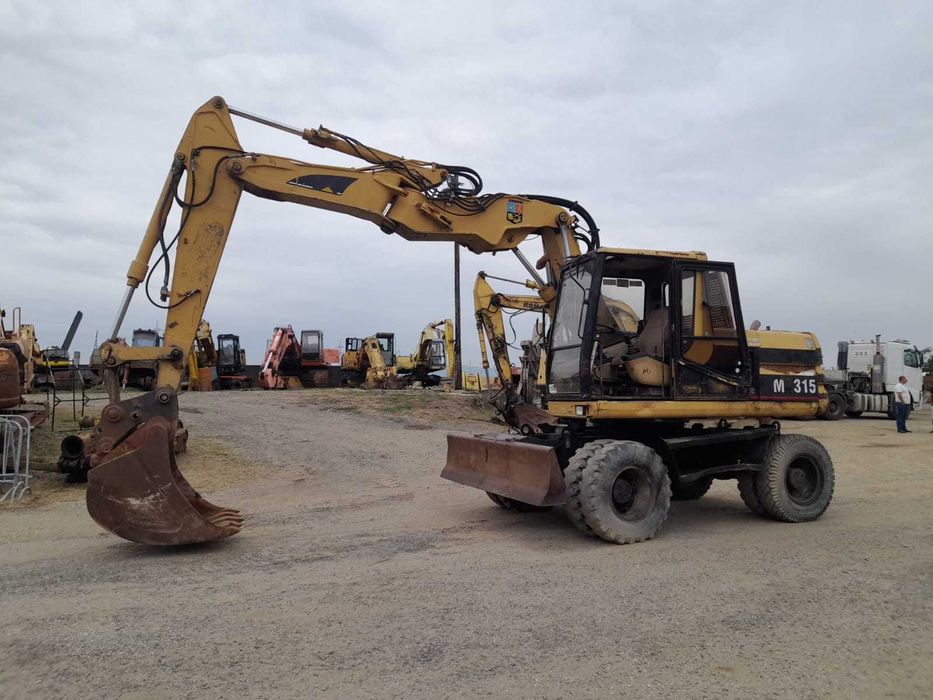 Piese excavator pe roti Caterpillar M 315