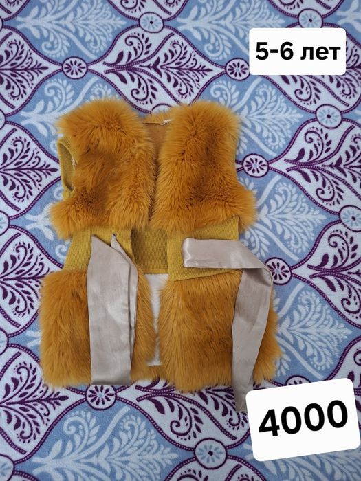 Продам пушистую жилетку