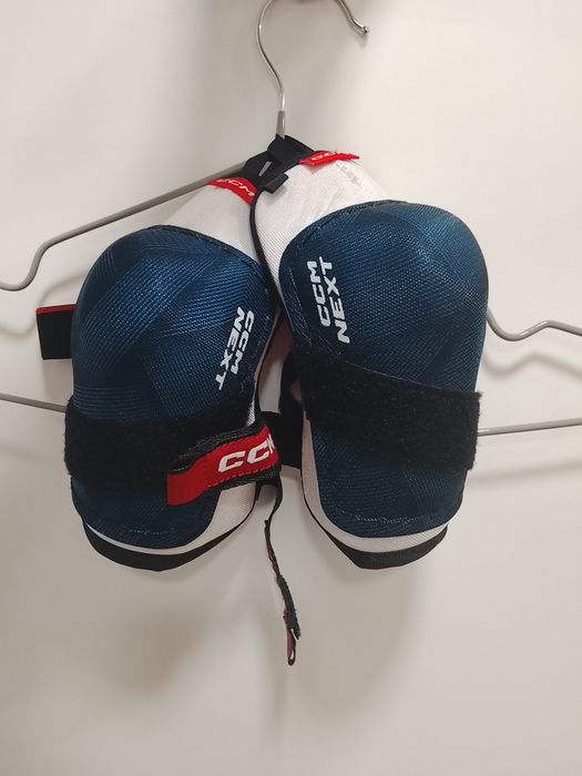 Налокотник CCM NEXT YTH белый, синий L  Детские