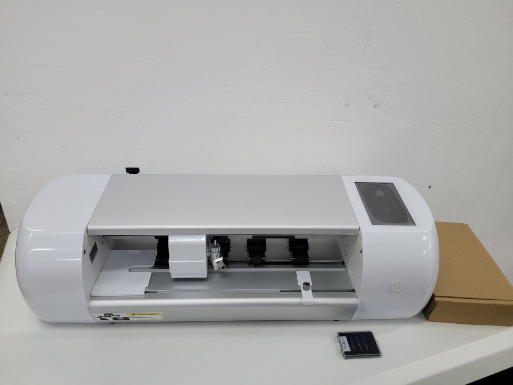 Plotter. Screen protector film cutter with built-in database