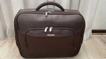 Малък кожен куфар на колелца Samsonite