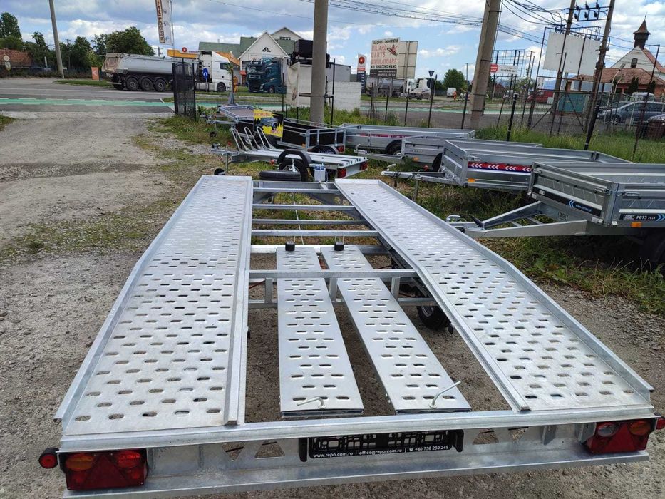 Platforma - Trailer 4,5 sau 5 m 2000-2700Kg  aplecată spate