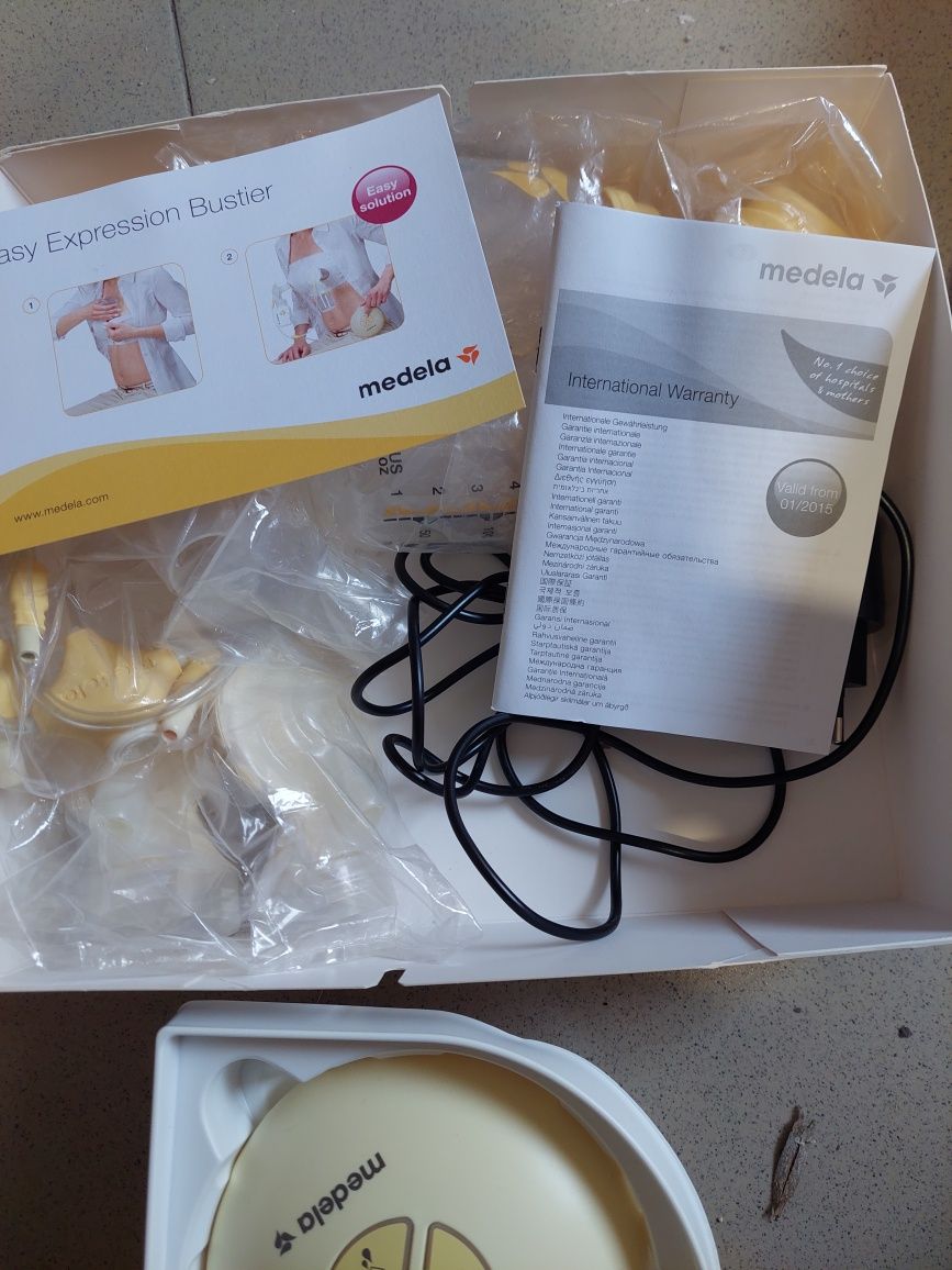 Medela Двойна двуфазна електрическа помпа за кърма Swing maxi