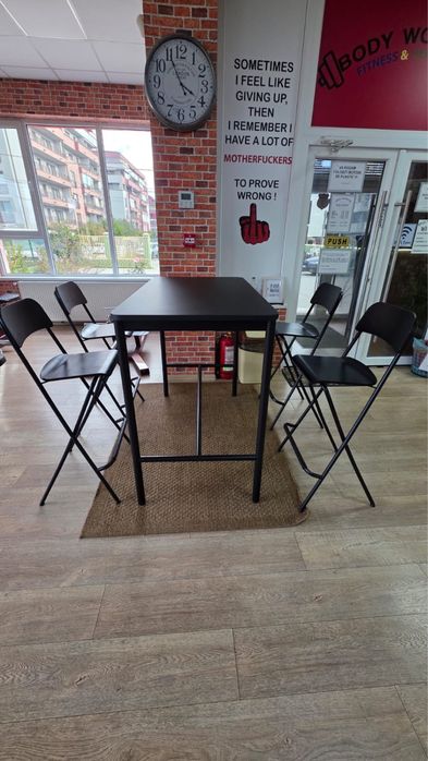 Black ikea bar table and bar stool foldable with brown rug