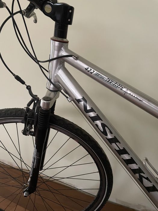Bicicleta trekking barbati Shimano XT si bicicleta dama Nishiki Hybrid
