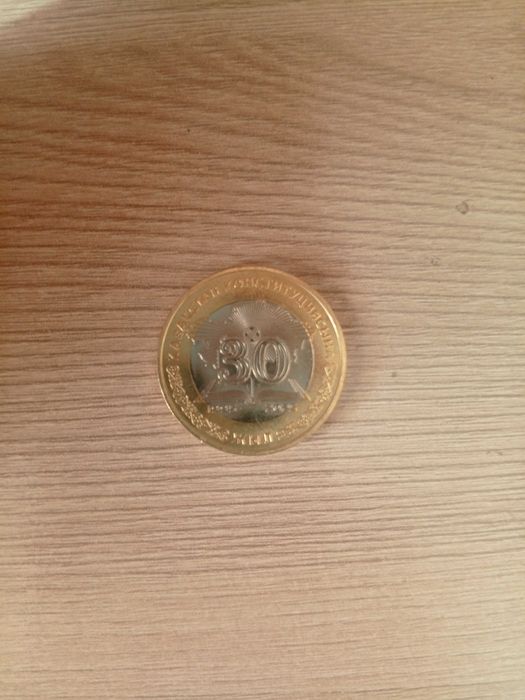 Монета номиналом 100тг
