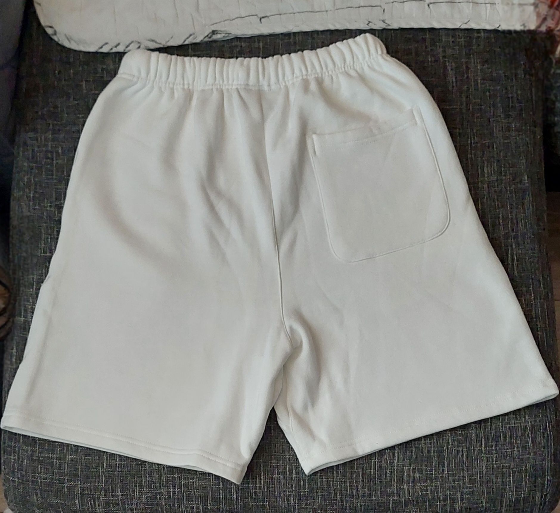 Fear of God Essentials white shorts