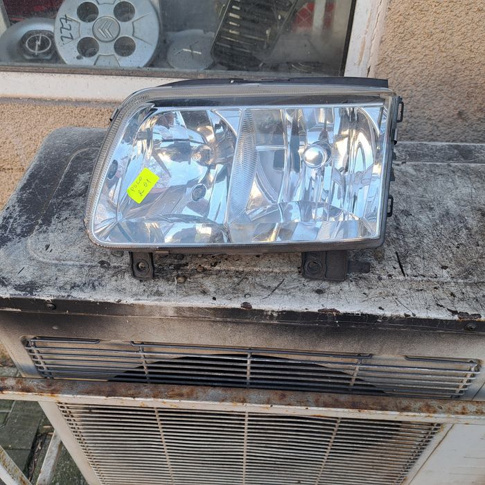 Оригинален фар Vw Polo feislift 99/01 Hella ляв