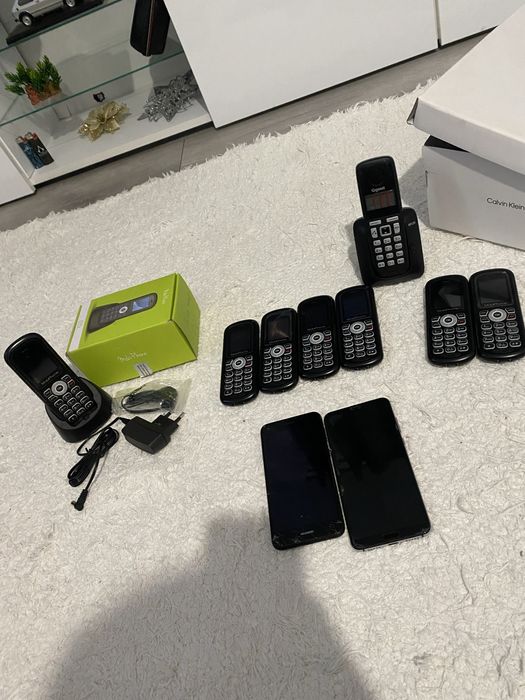 Telefon fix cu stand pentru incarcare si casti .noi noute