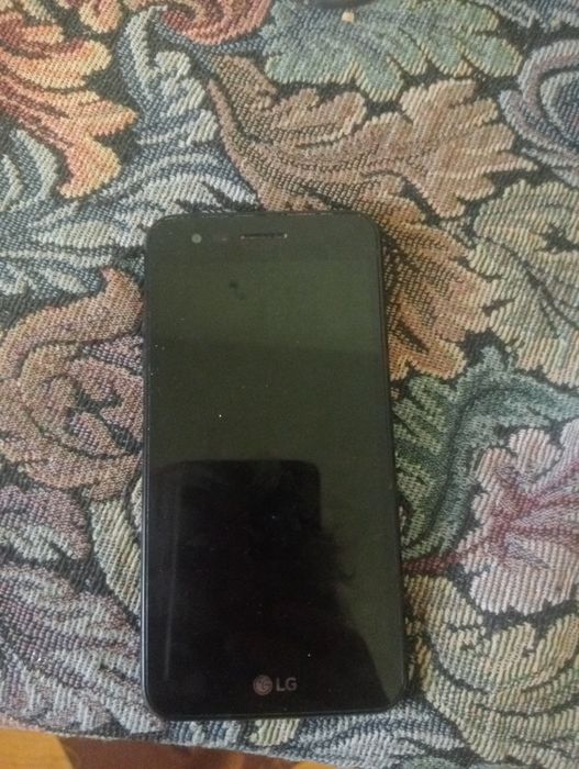 Tel LG 4 cu încărcător cu tot