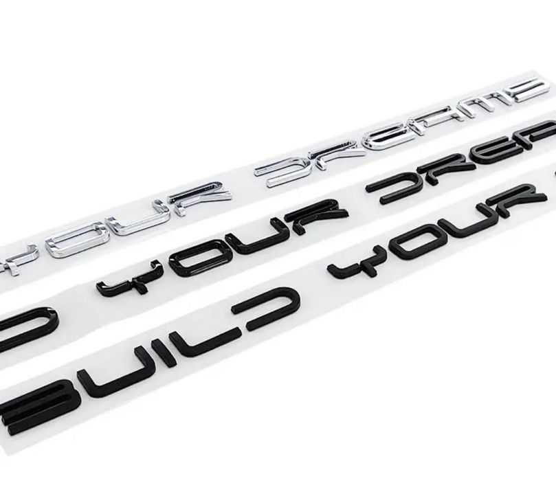 Шильдик “BUILD YOUR DREAMS” для BYD в черном глянце