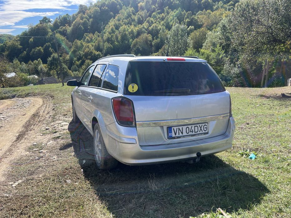 Vand sau schimb opel asta h  pret :2300€