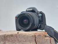 DSLR Nikon D3100 cu 2 obiective, accesorii și trepied